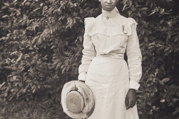 Martha "Patsy" Perkins holding a hat, 1901